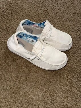 Hey Dude Women’s White Slip-On Sneakers with Blue Inner Pattern